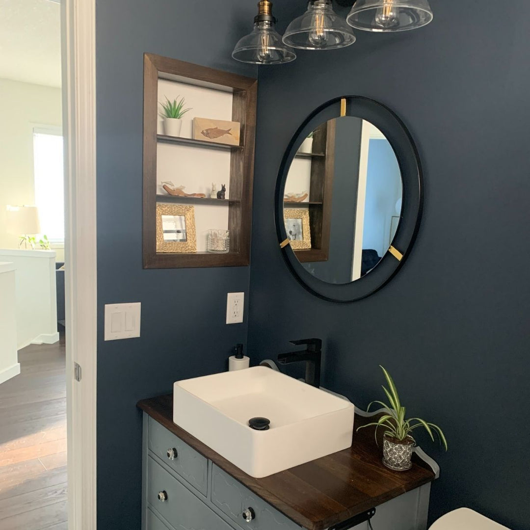 Ozzy Black Round Wall Mirror with Gold Accents by West Mirrors